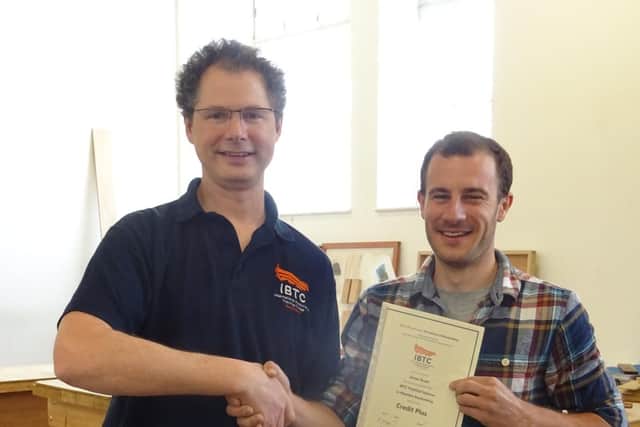 Student James Roser is congratulated by Head of Teaching Barnaby
Sheppard at IBTC Portsmouth
