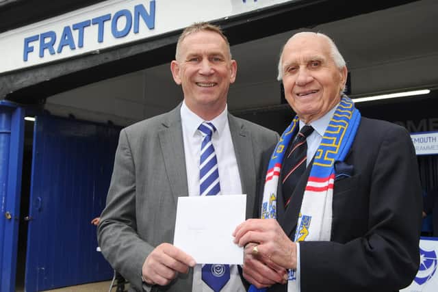 Alan Knight presenting a birthday card to Peter Hames. Picture: Sarah Standing (220419-6464)