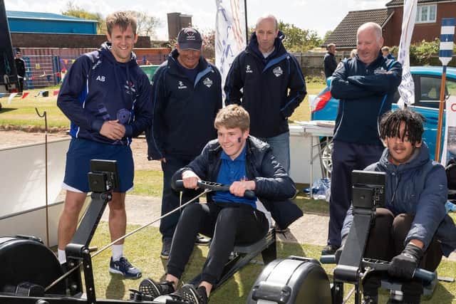 Tom Carralan and Maahin Choudhury race each other the rowing machines at the Langstone Pilot Gig club stand. Picture: Keith Woodland (270419-89)