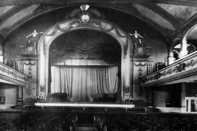 The magnificent stage in the theatre on South Parade Pier. Photograph: Barry Cox postacrd collection.