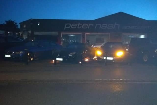 Picture captures moments after the fires began under vehicles at Peter Nash dealership. Picture: Austyn Follet