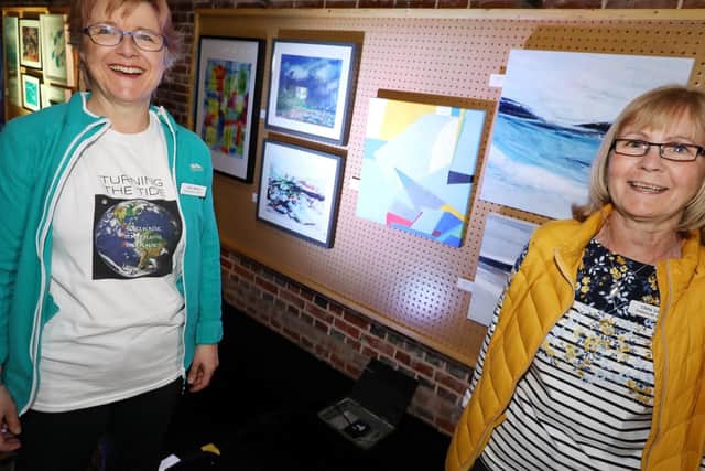 Ailsa Brims, left, and Chris Lewis, both of Peninsular Artists, with some of Chris' work. Turning The Tide art exhibition at Explosion Museum, Gosport