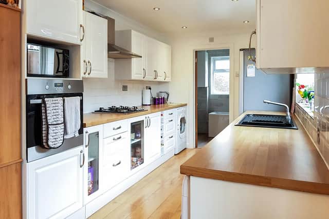 It has a modern fitted kitchen which has access to the rear garden.