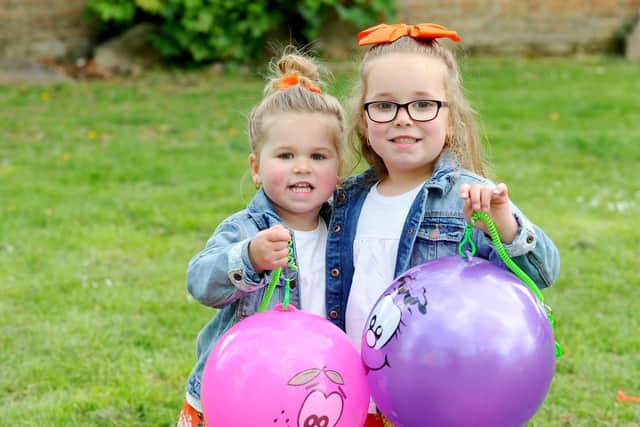 Edie-Rose Chambers, two, with her sister Ivy-Florence, four, from Portsmouth. Picture: Sarah Standing (060519-7109)