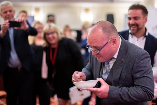 Gethin Jones, eating bugs at the latest meeting of Synergy Success Network. Picture by Solent Sky Services Ltd.