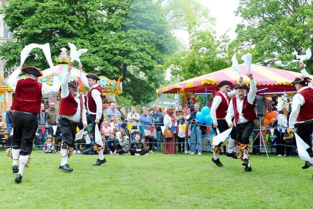 Morris dancers entertain the crowds. Picture: Sarah Standing (060519-8237)