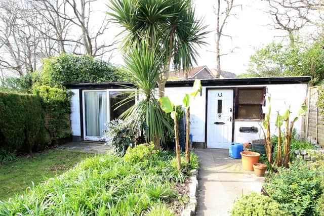 The house also comes with a summer house and workshop.