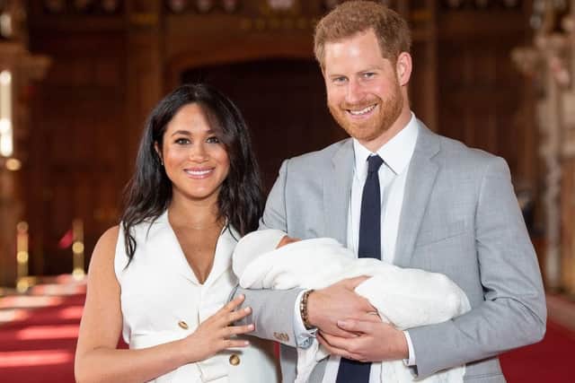 The Duke and Duchess of Sussex with their baby son, who was born on Monday morning, during a photocall in St George's Hall at Windsor Castle in Berkshire