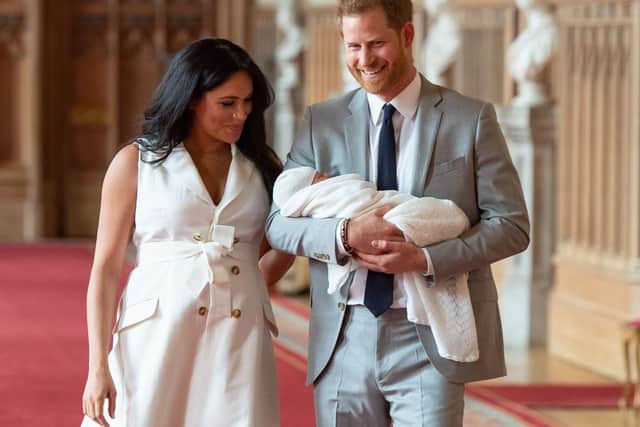 The Duke and Duchess of Sussex with their baby son, who was born on Monday morning, during a photocall in St George's Hall at Windsor Castle in Berkshire.