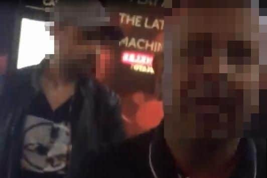 Footage shot by a woman in Commercial Road in Portsmouth as she confronts a group of men at a taxi rank.