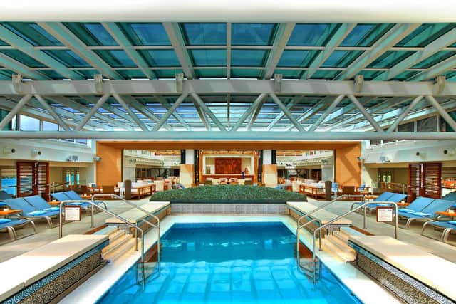 Viking main pool area during the day with the retractable roof closed