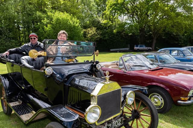 Jim Baumann (driver) and Stephen Emery (behind) with Jim's 1915 Model T Ford. Picture: Vernon Nash (270419-004)