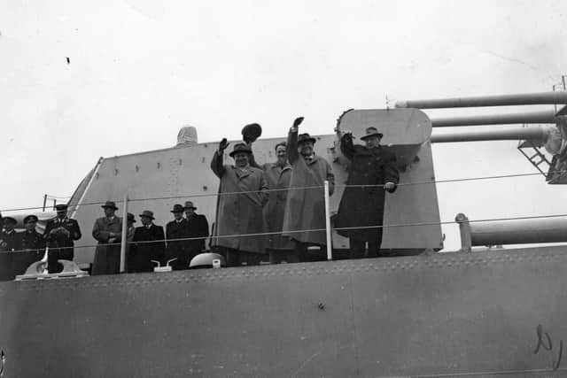 Nikolai Bulganin and Nikita Khrushchev, Soviet politicians, wave from the deck of the cruiser Ordzhonikidze as they leave Portsmouth following a 10-day visit to Britain.  With them are Russian aeronautical designer Andrei  Nikolaevich Tupolev, and atomic chief, Dr Igor Kurchatov, 2nd left.    (Photo by Folb/Getty Images)