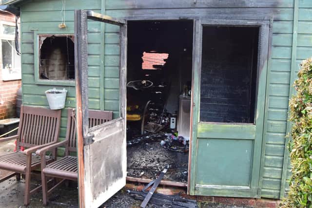 The fire completely destroyed one shed and caused serious damage to a second. Pictured is the remains of Andy Carpenter's garden shed. Photo: Tom Cotterill