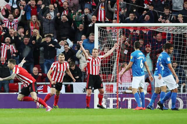 Substitute Chris Maguire, left, turns away to celebrate his winner Picture: Joe Pepler