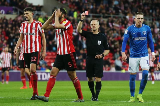 Referee Andy Woolmer shows Alim Ozturk a red card Picture: Joe Pepler