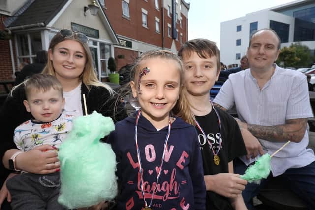 The Harper family, from left, Darcie with Blake, 3, Angel 6, Cameron, 13, and Jamie. Fun day in aid of Macmillan, Sovereigns pub, Kingston Crescent, Portsmouth.                         Picture: Chris Moorhouse    (110519-15)