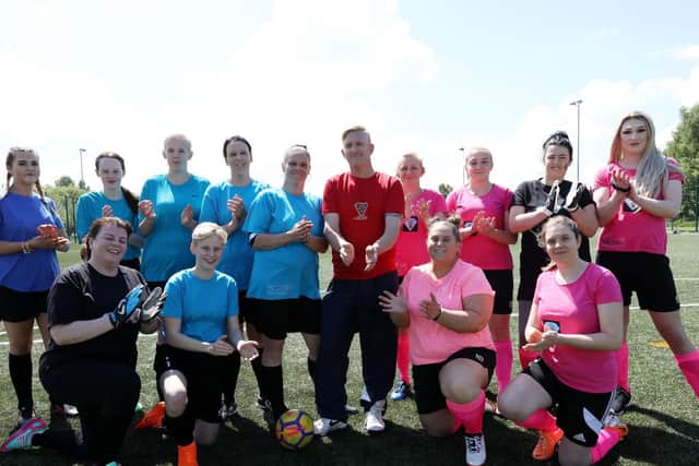 Applause for Demi's life before the ladies game, with Demi's parents, Kathleen and Phil Talman, centre. Demi Talman charity football match, Park Community School, Havant.                         Picture: Chris Moorhouse    (110519-11)