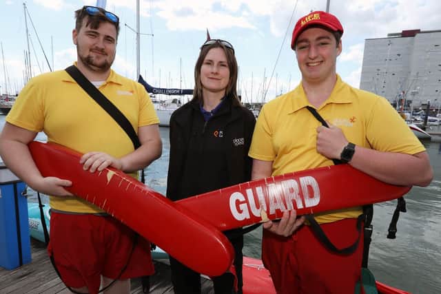 Lifeguards, from left, Callam James, Lucy May and Conor Hillier, all from Places Leisure. Gosport Marine Festival at Haslar Marina, Gosport. Picture: Chris Moorhouse (110519-18)