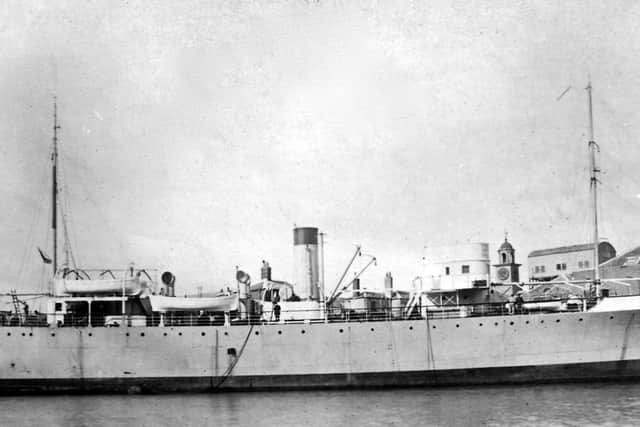 Does anyone recognise this ship and the location. The bell tower and the crane roof in the background might give clues. Picture: Robert James