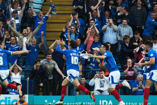 Michael Doyle celebrates with goalscorer Marc McNulty following the opener in the May 2016 League Two play-off semi-final first leg against Plymouth. Credit: Barry Zee
