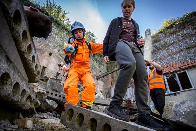 Rescue operators helping 'victims' at a staged landslide at Fort Widley, Portsmouth. Picture: Habibur Rahman