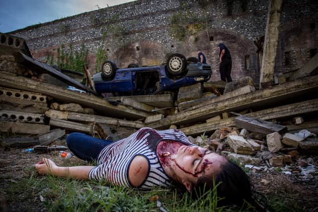Nursing student, Debbie Anton posing as a victim of a landslide. Picture: Habibur Rahman