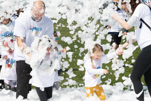 Competitors sprayed with foam. Picture: Keith Woodland (110519-45)
