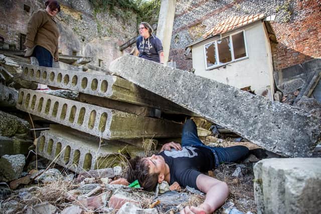 Brokenhurst college student, Ethan Kettle posing as a 'victim' waiting to be rescued in a simulated landslide at Fort Widley. Picture: Habibur Rahman