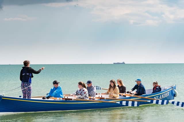 Ellie Shepherd and Rachel Padmore prepare to row out in a gig. (5th and 6th left) Picture: Keith Woodland (110519-27)