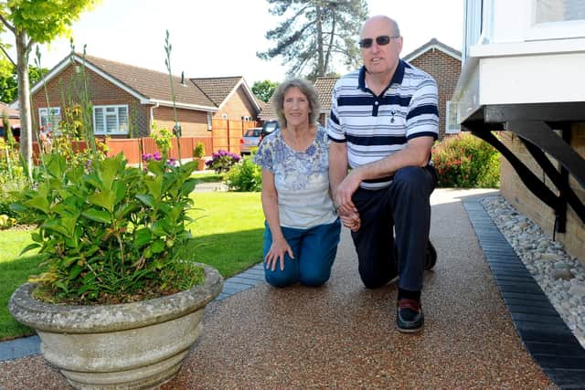 Caroline and Phillip Goodboy on their driveway which they had to pay extra for a new company to come and rectify after Resin Drives South Ltd left them out of pocket and with the job unfinished. Picture: Sarah Standing (130519-9144)