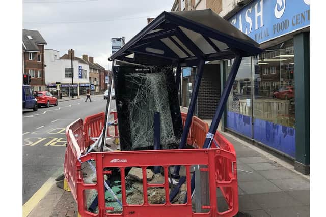 Bus shelter damage at Kingston Road, Portsmouth after the accident in the early hours. Picture: Dan Lee/ M Cutting barbers shop