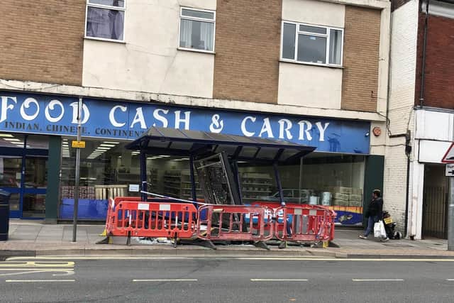 Bus shelter damage at Kingston Road, Portsmouth after the accident in the early hours. Picture: Dan Lee/ M Cutting barbers shop