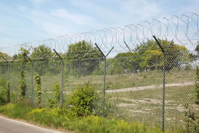 The naval signal school, HMS Mercury, closed in 1993 but razor wire still encloses the site.