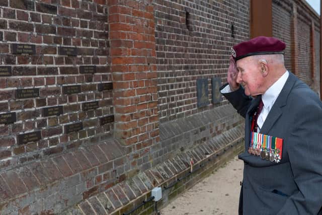 Veteran At D-Day Story Museum in Southsea - Veteran glider pilot Laurie Weeden at the D-Day Memorial Wall. Picture: Vernon Nash (180519-007)