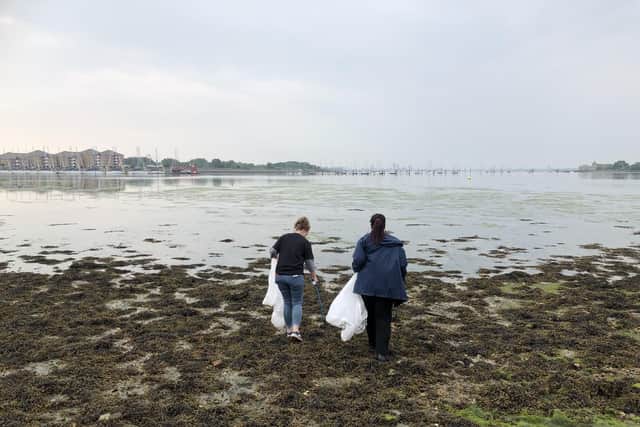The team from the Portsmouth Marriott Hotel collecting rubbish on Portchester shore