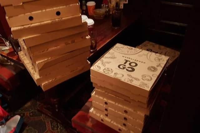 Piles of pizzas at Wetherspoons after Chris' first homeless feed in Southampton