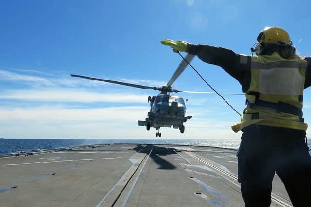 Hectic time for HMS Westminster on NATO Baltic mission
A Seahawk helicopter touches down on Westminsters flight deck.
Picture: HMS Westminster and US Navy