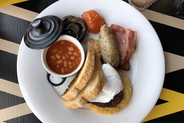 The Cosy Club Breakfast, with an additional halloumi and sweetcorn fritter, beneath the poached egg