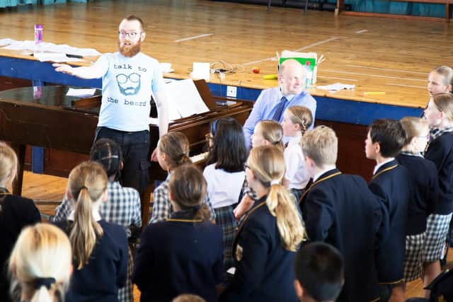 Pupils in rehearsal for The Key Note of Everything to be SIMPLICITY. Standing at the back is composer James Olsen