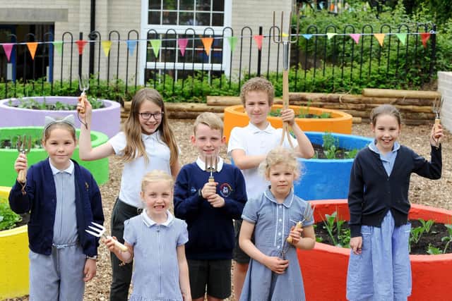 Titchfield Primary School officially opened their new allotment on Friday, May 24.Pictured is: (back l-r) Refkah Hawkridge (11), Connor Miller (8) and Rico Daiboun (11) with (front l-r) Lacey Collins (8), Francesca Donovan (6), Jessica Yarrow (5) and Erin Hale (10).Picture: Sarah Standing (240519-8409)