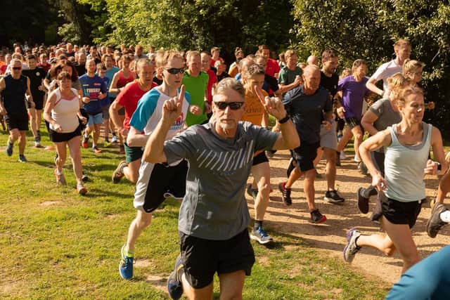Tony Hoskinson enjoying the sunshine at Havant parkrun. Jackie Lloyd, right, finished second lady. Picture: Keith Woodland (250519-11)