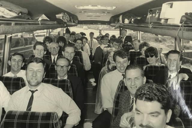 Former Kenwood staff pictured on a coach during one of the firm's social days