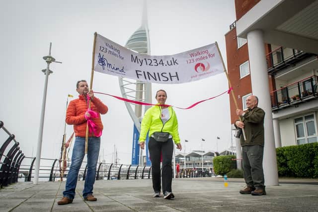 Louise Ballard at Gunwharf Quays with her partner, Keith, and her father, Barry, after walking almost 130 miles from Abergavenny to her birthplace of Portsmouth, to raise awareness of endometriosis. Picture: Habibur Rahman