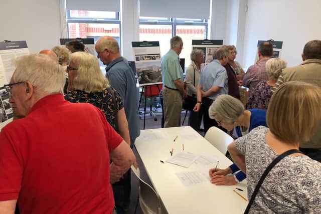 Residents take in the latest plans for the Wellington Way development at Waterlooville Library, on Thursday
