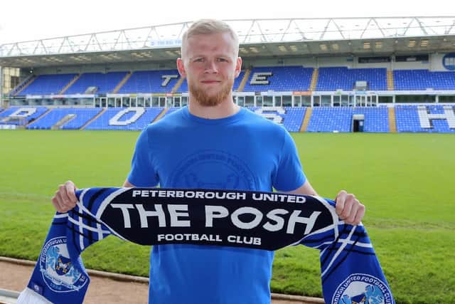 Twenty-three-year-old Kings Lynn left-back has signed a two-year contract with the Posh after a successful trial period.