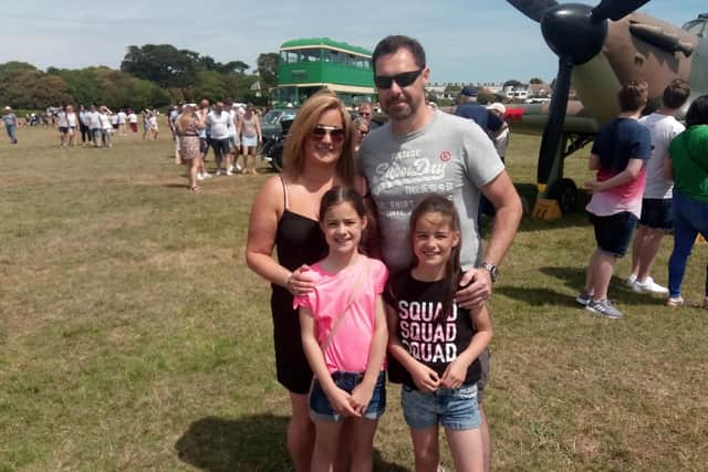 Claire and Bill Crowson alongside daughters Grace (left) and Jessica.