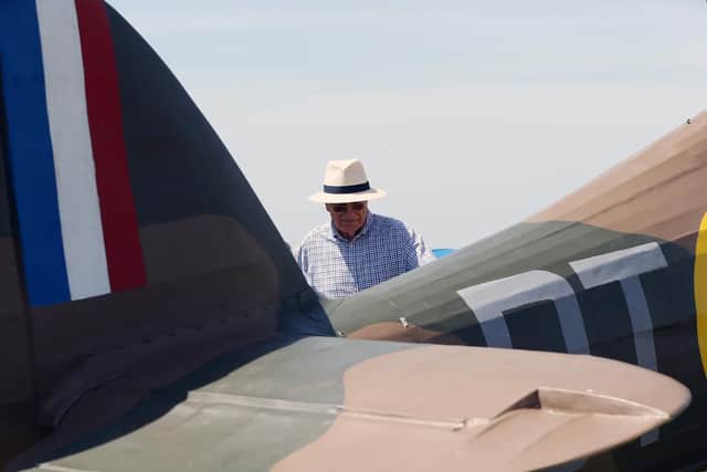 D-Day event at Stokes Bay, Gosport. John Bunch admires a Hawker Hurricane. Commemorative D-Day event at Stokes Bay highlighting the part that the borough of Gosport played in 1944. Picture: Chris Moorhouse (010619-38)