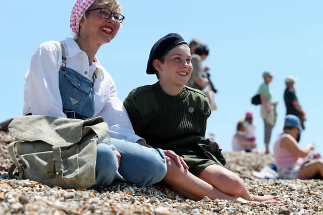 D-Day event at Stokes Bay, Gosport. Caroline Porter and her son, Artie, 10. Commemorative D-Day event at Stokes Bay highlighting the part that the borough of Gosport played in 1944. Picture: Chris Moorhouse (010619-37)