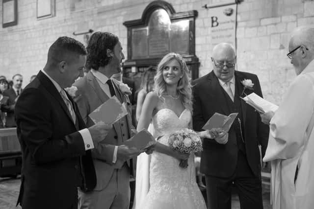 The couple read their vows at St Mary's Church, Portchester Castle. Picture: Carla Mortimer Photography